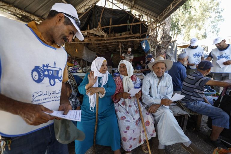 Volunteers from Morocco’s Authenticity and Modernity Party (PAM) distribute campaign leaflets ahead of the September 23 legislative election [Abdel Majid BZIOUAT / AFP]